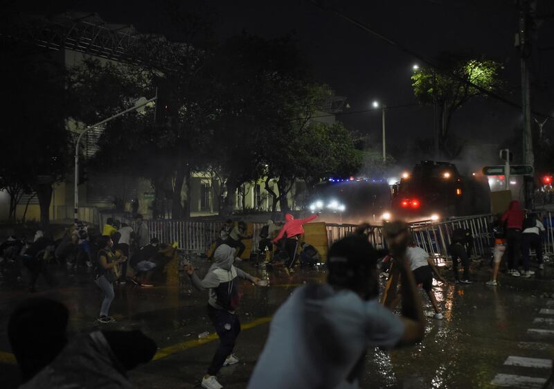 Demonstrators clash with police during a protest during a Copa Libertadores match between America de Cali and Atletico Mineiro which was halted several times as players were affected by tear gas fired outside the Estadio Olimpico Romelio Martinez. Reuters