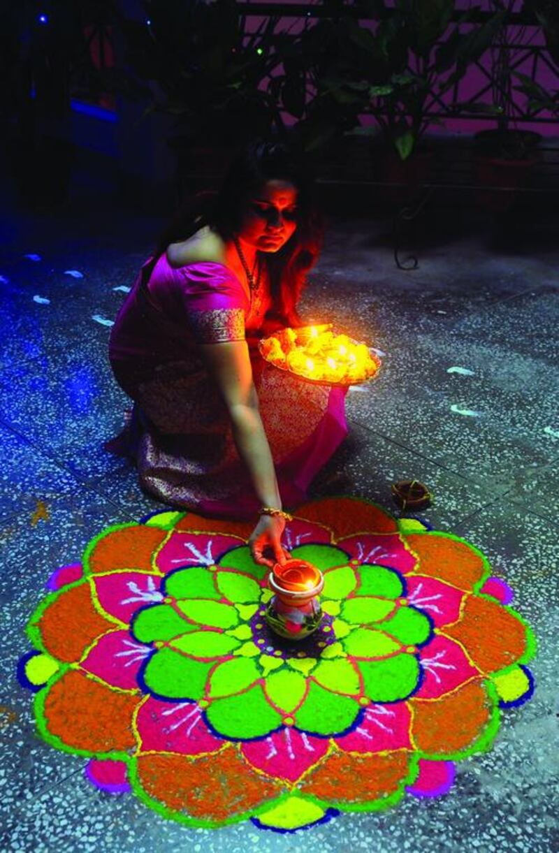 Earthen lamps are lit during Diwali celebrations in Allahabad, India. Sanjay Kanojia / AFP