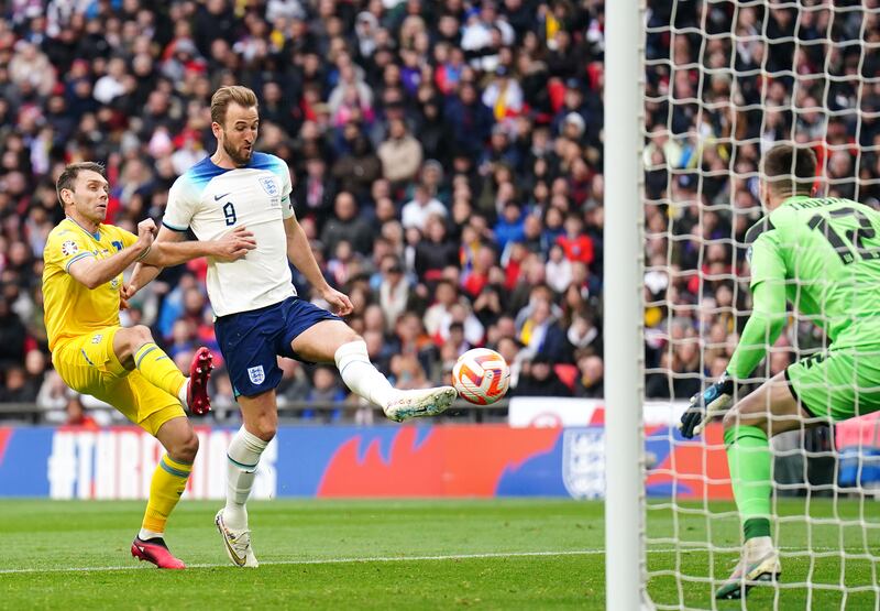 Harry Kane scores England's opening goal. PA