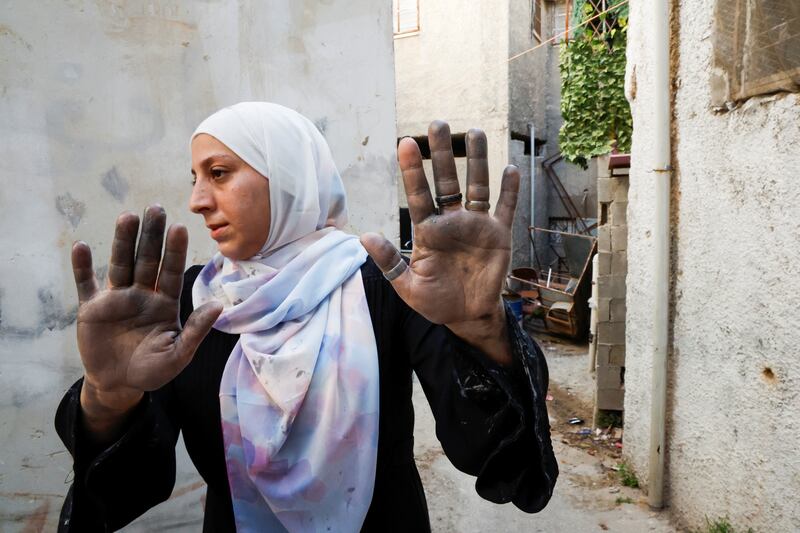 Palestinian Samah Sabagh shows her hands after the two-day Israeli raid in Jenin. Reuters