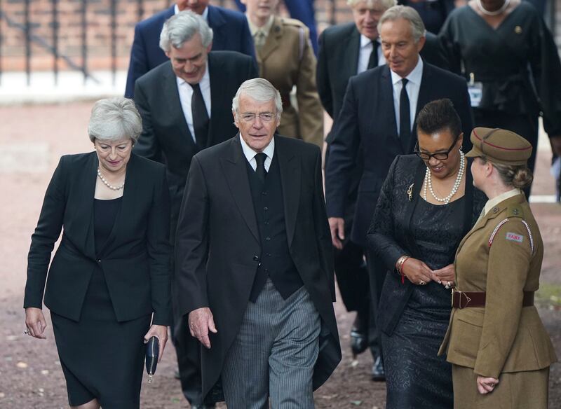 Former British prime ministers Theresa May, front left, and John Major, centre, and Baroness Scotland arrive for the Accession Council ceremony at St James's Palace. AP