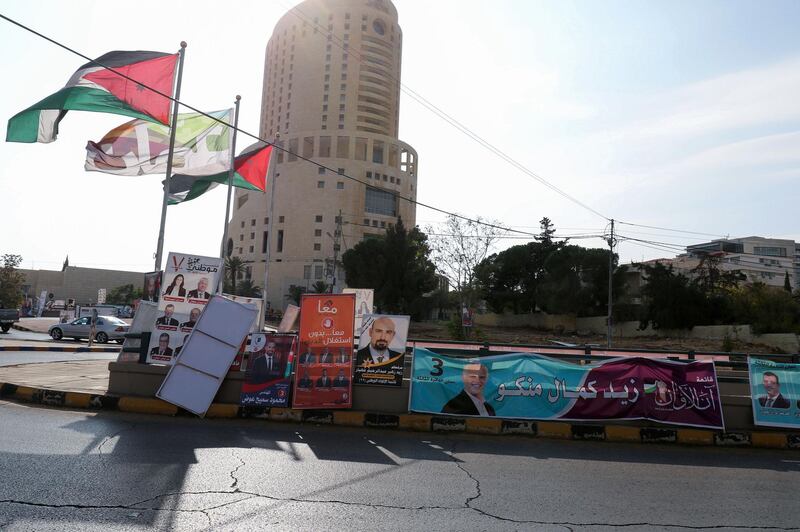 Campaign banners and slogans of candidates for the upcoming Jordanian parliamentary elections line a street in the capital Amman. AFP