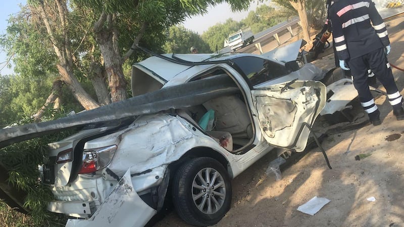 A car involved in an accident on Abu Dhabi - Al Ain Road is skewered by a metal barricade. Courtesy Abu Dhabi Police