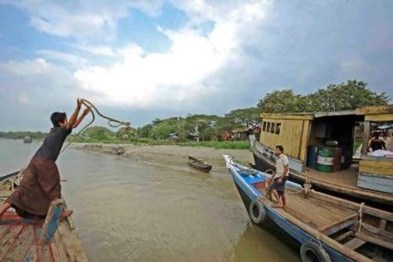 Boatmen at Mawlimyine, a sleepy town with a few-colonial era monuments. Photo by Amar Grover for The National