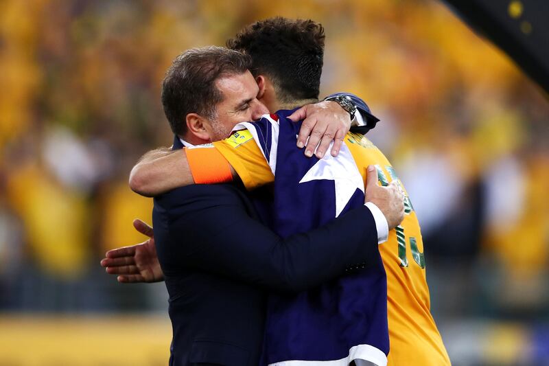 Australia manager Ange Postecoglou and Mile Jedinak embrace after the final whistel. Mark Kolbe / Getty Images