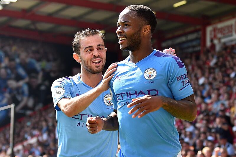 Manchester City's Raheem Sterling celebrates scoring his team's second goal with teammate Bernardo Silva. AFP