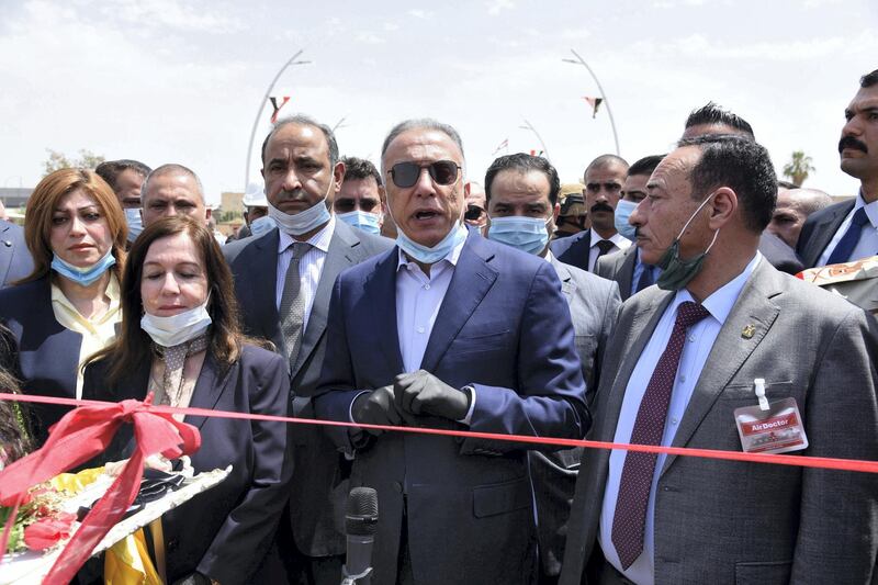 epa08477058 Iraqi Prime Minister Mustafa al-Kadhimi (C) speaks during the reopening ceremony of a bridge which connects East and West Mosul, northern Iraq, 10 June 2020. Al-Kadhimi visited Mosul on the sixth anniversary of its occupation by militants of the Islamic State (IS) terror organization in June 2014, after which Iraqi troops backed by the US-led international coalition forces launched a military campaign that lasted for three years to expel the IS  fighters from the city.  EPA-EFE/AMMAR SALIH *** Local Caption *** 56143249