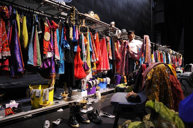 Sayed Faisal, wardrobe manager, The Merchants of Bollywood, inspects the costumes used during the performances.