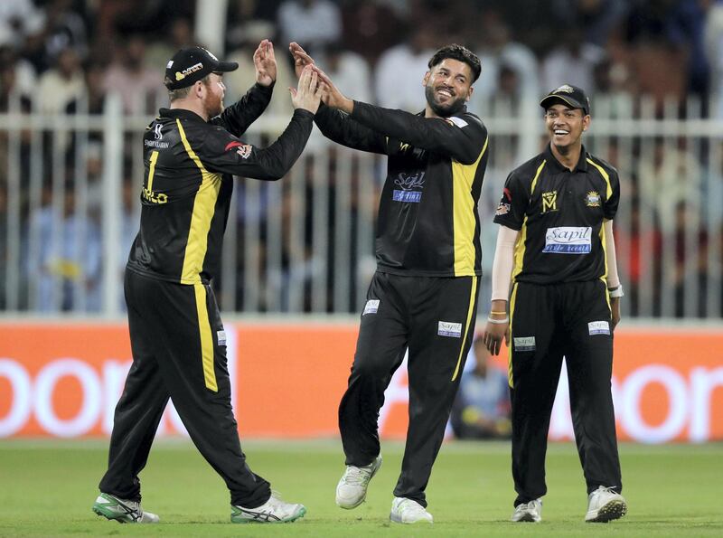 Sharjah, United Arab Emirates - November 21, 2018: Kings' Mohammad Naveed celebrates his run out of Pakhtoons' Chadwick Walton during the game between Pakktoons and Kerala Kings in the T10 league. Wednesday the 21st of November 2018 at Sharjah cricket stadium, Sharjah. Chris Whiteoak / The National