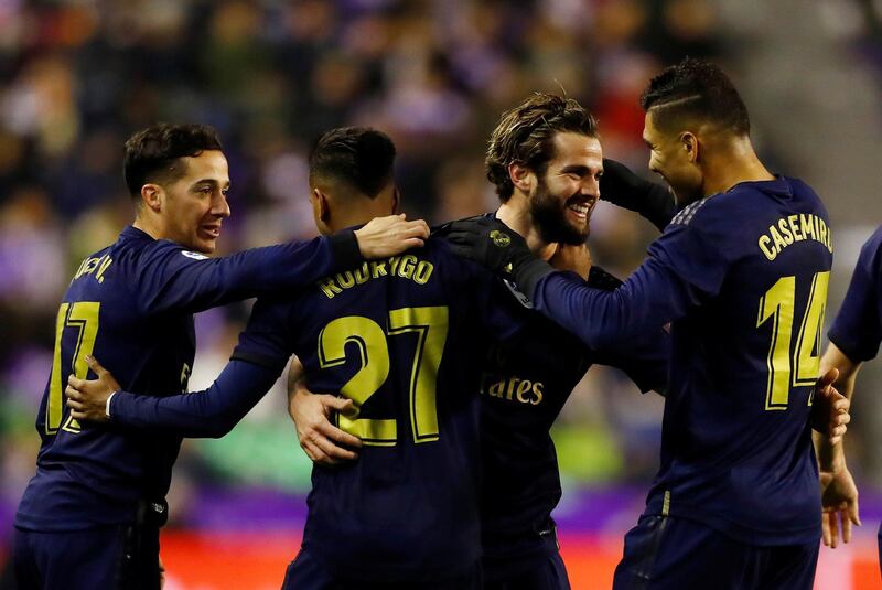 Real Madrid's Nacho celebrates scoring their first goal with teammates. Reuters