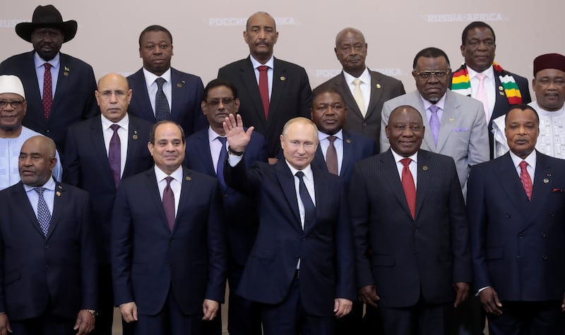 President Vladimir Putin waves alongside leaders taking part in the Russia-Africa summit in Sochi, Russia, in 2019. Reuters