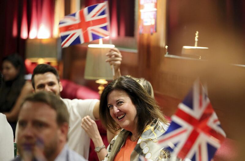 DUBAI , UNITED ARAB EMIRATES , MAY 19 – 2018 :- People watching the ceremony of British Royal Wedding at the Golden Lion Pub on the QE2 at Port Rashid in Dubai.  ( Pawan Singh / The National )  For News