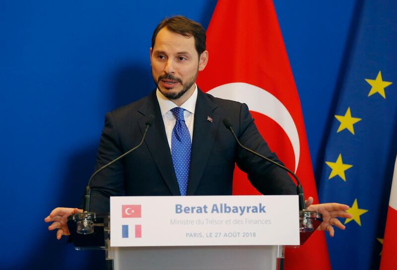Turkey's Treasury and Finance Minister Berat Albayrak, gestures as he make declarations to the media with France's Finance Minister Bruno Le Maire at the ministry in Paris, France, Monday, Aug. 27, 2018. Turkey's Treasury and Finance Minister Berat Albayrak is in Paris for bilateral talks. Turkey's Treasury and Finance Minister Berat Albayrak is in Paris for bilateral talks. (AP Photo/Michel Euler)