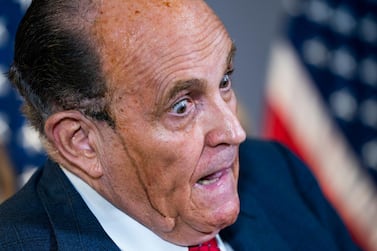 Rudy Giuliani speaking, as hair dye runs down his face. EPA