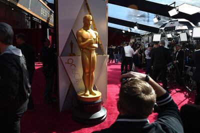 (FILES) In this file photo taken on March 04, 2018 Photographers and TV crews get ready on the red carpet a few hours before the "Oscars", the 90th Annual Academy Awards in Hollywood, California.  The 93rd Oscars have been postponed by eight weeks to April 25 after the coronavirus pandemic shuttered movie theaters and wreaked havoc on Hollywood's release calendar, the Academy said June 15, 2020. / AFP / Robyn BECK                         

