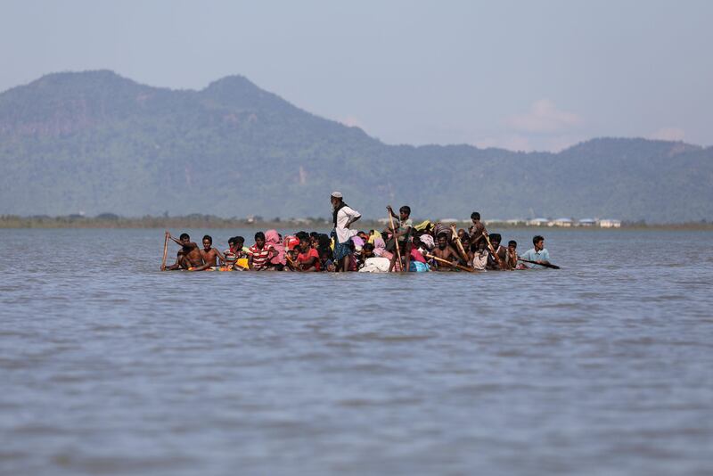 Rohingya refugees cross the Naf River with an improvised raft to reach to Bangladesh at Sabrang near Teknaf, Bangladesh. Mohammad Ponir Hossain / Reuters