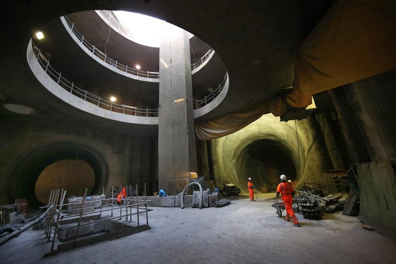 A worker shifts dirt through the eastern ticket hall near Hannover Square. Peter Macdiarmid / Getty Images