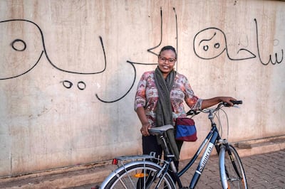 Enass Muzamel has launched a campaign in Khartoum to encourage women to cycle and free themselves from social limitations and taboos. Mrs Muzamel has been threatened to be lashed by young men for her initiative and for not wearing a headscarf. Courtesey: Enass Muzamel for The National 