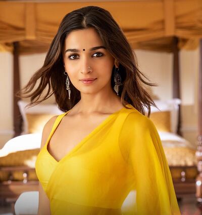 Alia Bhatt pairs her colourful saris with minimalist blouses. Photo: Dharma Productions