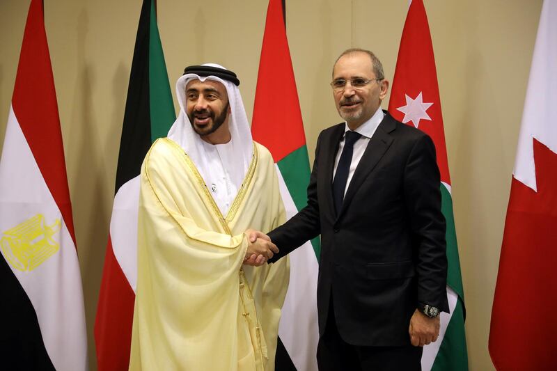 Sheikh Abdullah bin Zayed shakes hands with Jordanian Foreign Minister Ayman Safadi ahead of informal talks at the King Hussein Convention Centre at the Dead Sea. Reuters