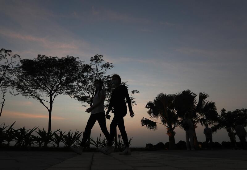 epa08956105 People enjoy the nice weather at the Bluewaters Island during sunset in Gulf Emirate of Dubai, United Arab Emirates, 21 January 2021.  EPA/ALI HAIDER