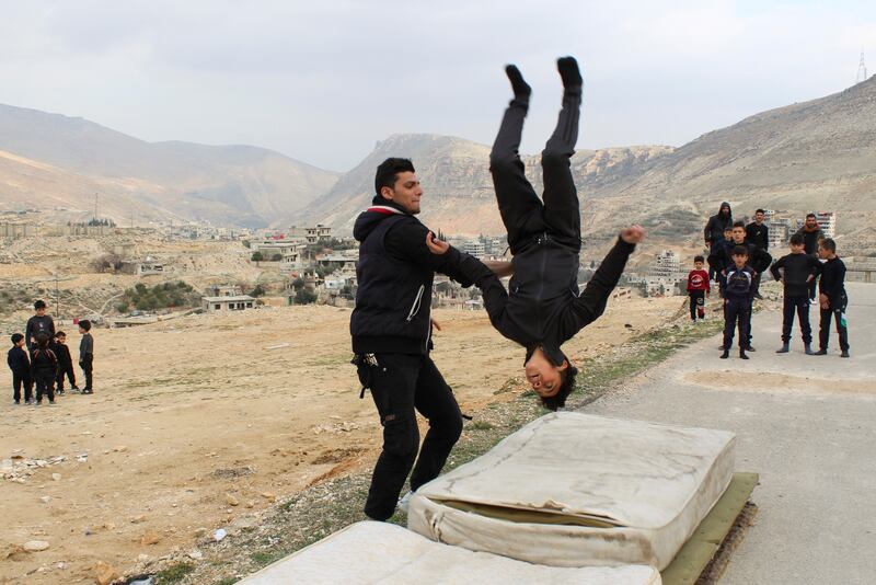 Coach Hassan Mansour puts his students through their paces during a training session in Barada Valley, a Damascus suburb.