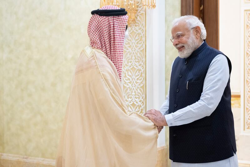 Sheikh Tahnoon bin Zayed, National Security Adviser, greets Mr Modi.