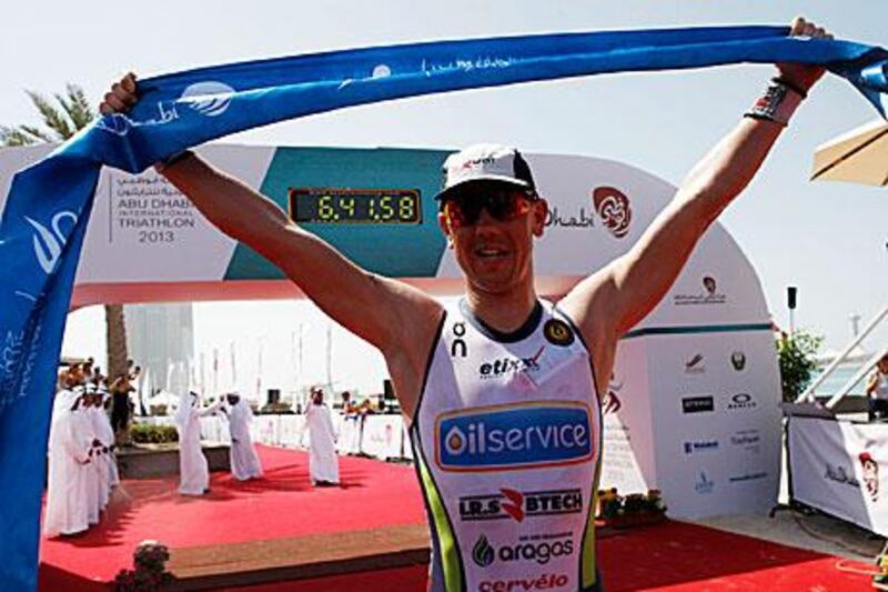 Frederil van Lierde crosses the finish line for the long course. Cristopher Pike / The National