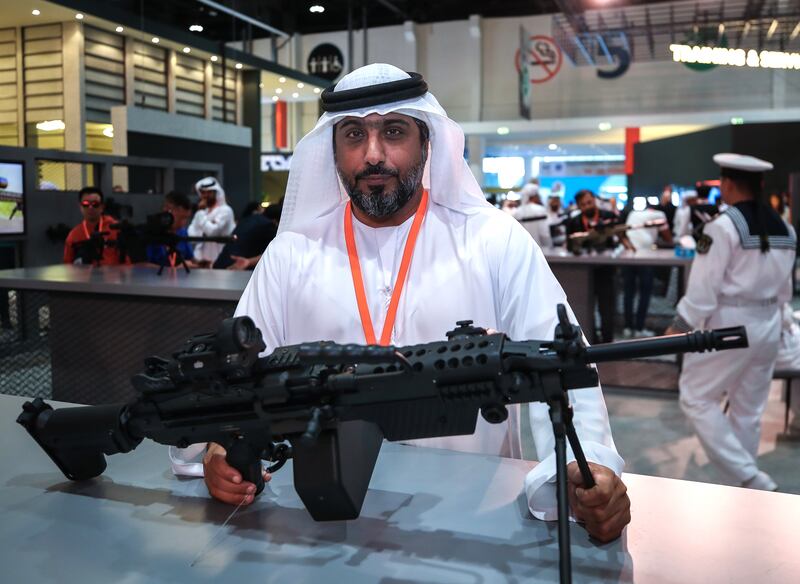 Hamad Al Ameri, chief executive of Caracal, with the new Caracal light machinegun that was unveiled at the International Defence Exhibition. Victor Besa / The National