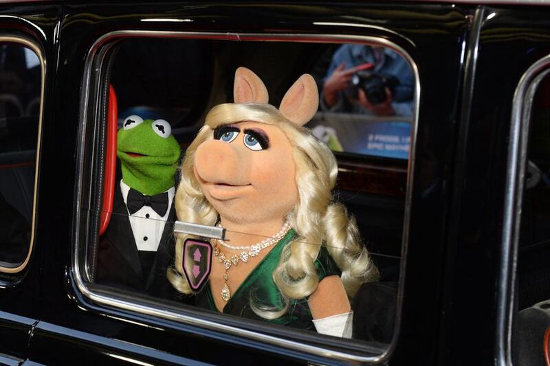 Kermit The Frog, Miss Piggy and Constantine arrive. Dave J Hogan / Getty Images