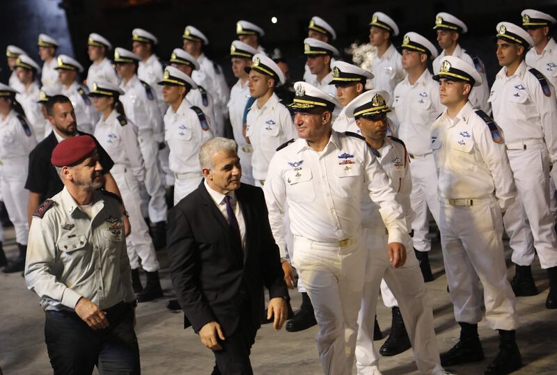 Israeli Prime Minister Yair Lapid, centre, at a graduation ceremony for naval officers in Haifa, on September 7, 2022. AFP
