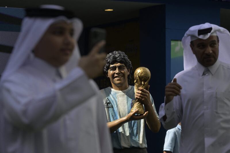 A statue depicting late Argentine football star Diego Maradona is seen during his tribute ceremony on the second anniversary of his death at the "Tree of dreams" in the CONMEBOL fan zone in Doha. AFP