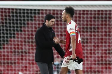 Arsenal striker Pierre-Emerick Aubameyang and coach Mikel Arteta after the defeat at home to Burnley. EPA