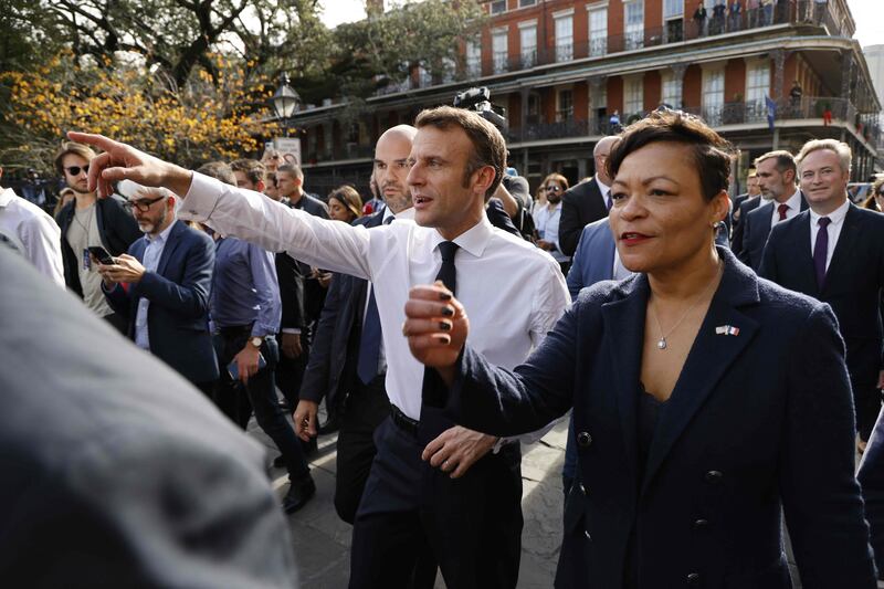 Ms Cantrell takes Mr Macron on a walking tour through the historic French Quarter. AFP