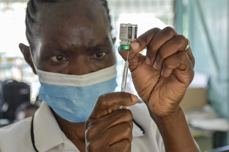 A health worker prepares a malaria vaccination for a child at a hospital in Kenya. Experts have welcomed the approval of the jab but said the threat of resistance remains. Brian Ongoro / AFP