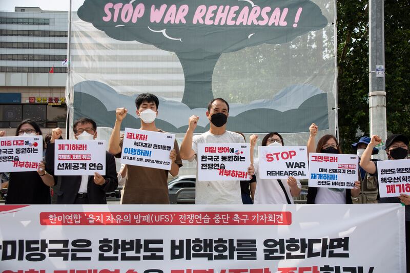 People protest against the joint South Korea-US military exercises near the presidential office in Seoul. EPA