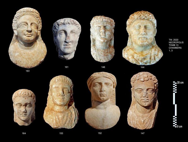 Eight marble masks dating back to the Greek and Roman eras, found at the Taposiris Magna Temple. EPA