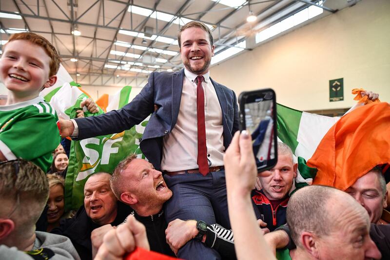 Sinn Fein's Donnchadh Ó Laoghaire (C) celebrates being the first TD elected to the 33rd Dáil, topping the poll ahead of Micheál Martin, Simon Coveney and Michael McGrath at Nemo Rangers GAA Club on February 9, 2020 in Cork, Ireland. Getty Images