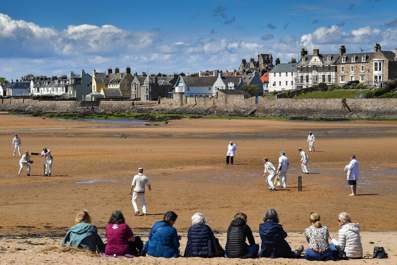 ELIE, ENGLAND - MAY 12: Cricket players from the Ship Inn and Borderers teams hold the first match of the season at the beach on May 12, 2019 in Elie, Scotland. The Ship Inn pub is the only cricket team in the United Kingdom to play their matches on a beach. Over the course of a season they hold regular fixtures against Scottish clubs as well as touring teams from across the world. (Photo by Jeff J Mitchell/Getty Images) *** BESTPIX ***
