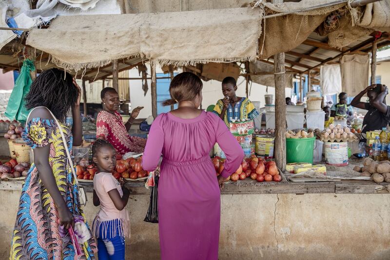 Customers queue at a market stall in Juba, South Sudan.