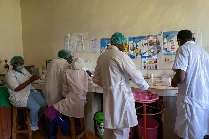 Medical workers prepare medicine at the Matanda Hospital in Butembo, where the first case of Ebola died, in the North Kivu province of Congo, February 11, 2021. AP Photo