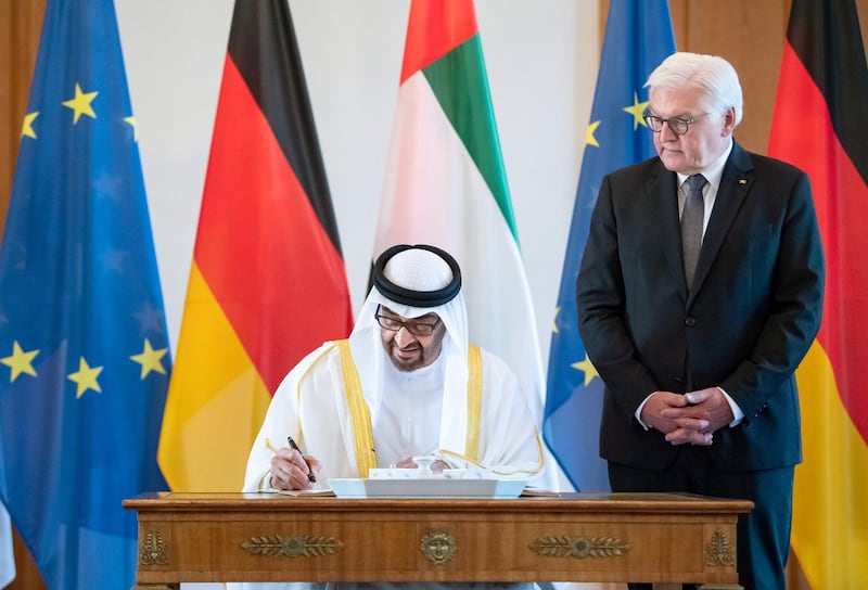 Sheikh Mohamed bin Zayed signs the Golden Book next to Frank-Walter Steinmeier. AFP