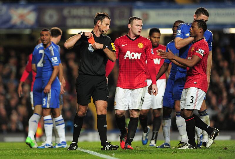 LONDON, ENGLAND - OCTOBER 28:  Referee Mark Clattenburg puts his red card away after sending off Branislav Ivanovic of Chelsea during the Barclays Premier League match between Chelsea and Manchester United at Stamford Bridge on October 28, 2012 in London, England.  (Photo by Shaun Botterill/Getty Images) *** Local Caption ***  154884079.jpg