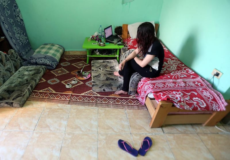 A Syrian sex trafficking victim sits in her safehouse at an undisclosed location in Lebanon on April 13, 2016, after she fled a brothel in Lebanon where she was being held captive. AFP Photo