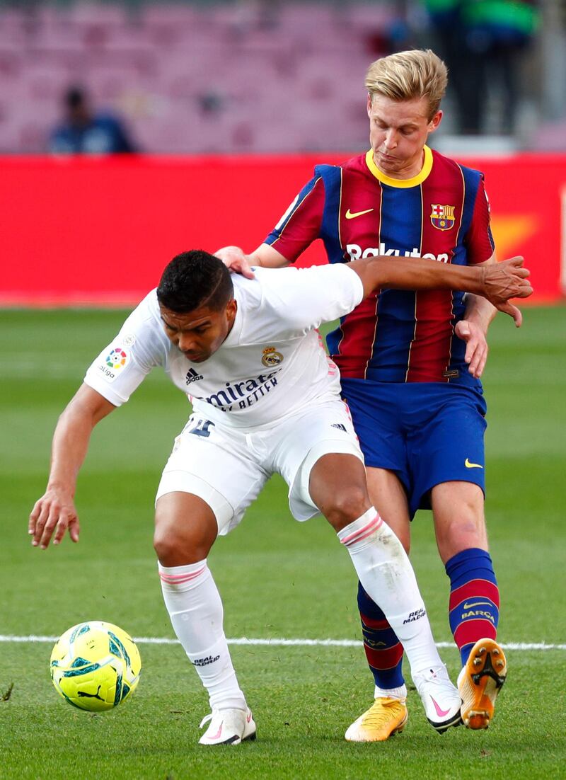 Real Madrid's Casemiro under pressure from Frenkie de Jong of Barca. AP