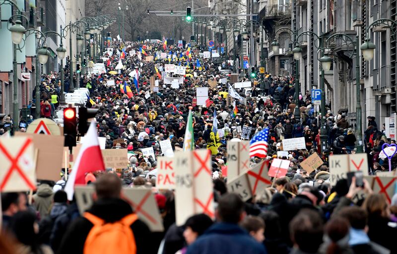 Some of the estimated 50,000 who marched through the streets of Brussels in protest against anti-coronavirus measures in EU countries. AP