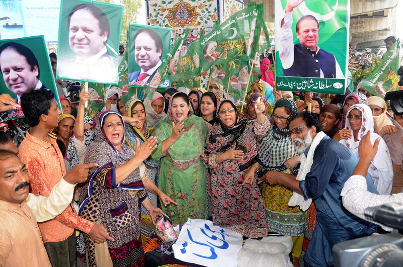 epa06118792 Supporters of former Prime Minister Nawaz Sharif, shout slogans against Imran Khan, the head of opposition political party Pakistan Tehrik-e-Insaf during a protest in Multan, Pakistan, 31 July 2017. Prime Minister Nawaz Sharif stepped down on 28 July following the Supreme Court's decision to disqualify him from holding public office over his links to the so-called "Panama Papers" corruption scandal.  EPA/FAISAL KAREEM