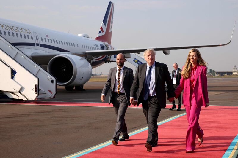 Boris Johnson and his wife Carrie arrive in Kigali. AFP