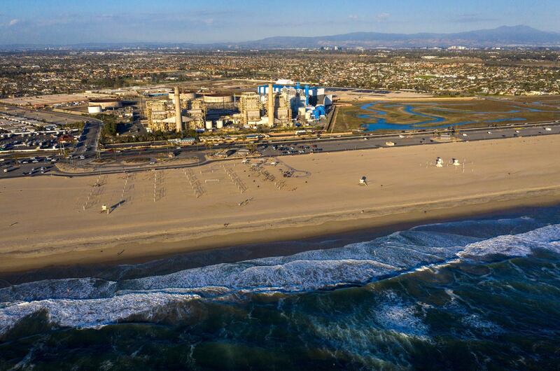 HUNTINGTON BEACH, CA - February 17: A view of the older AES Huntington Beach Power Station at left, and new one at right, and is the proposed site of the Poseidon Desalination Plant, which would draw ocean water through an existing intake pipe at Wednesday, Feb. 17, 2021 in Huntington Beach, CA. (Allen J. Schaben / Los Angeles Times via Getty Images)