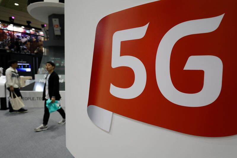 Signage for 5G is displayed at the KT Corp. booth at the World IT Show 2018 in Seoul, South Korea, on Wednesday, May 23, 2018. The show runs through May 27. Photographer: SeongJoon Cho/Bloomberg